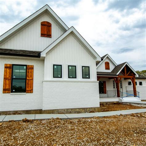 brick house white metal balcony|white brick exterior ideas.